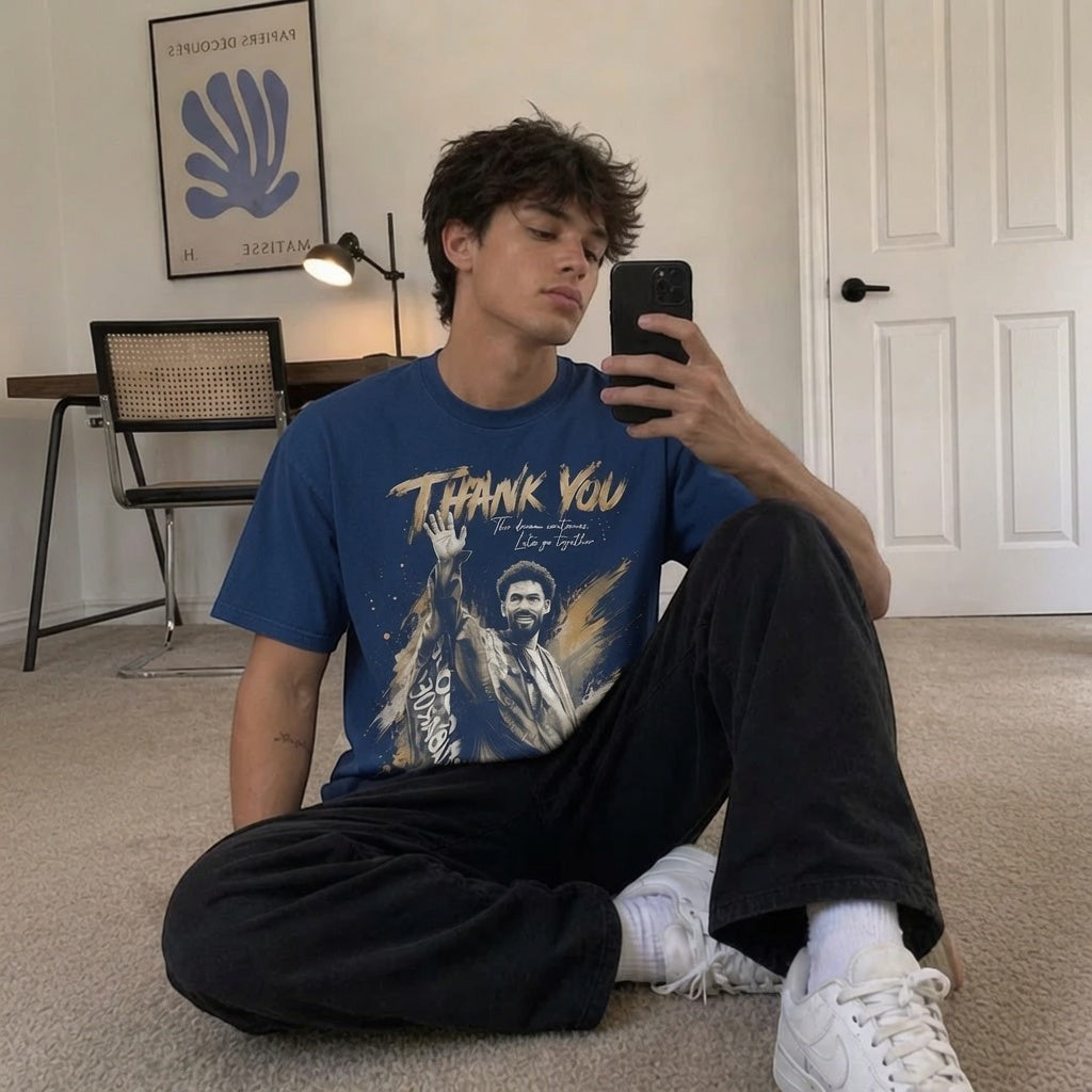 TrendyShift.Com blue oversized cotton tribute t-shirt featuring a goalkeeper farewell graphic, worn by a young man.