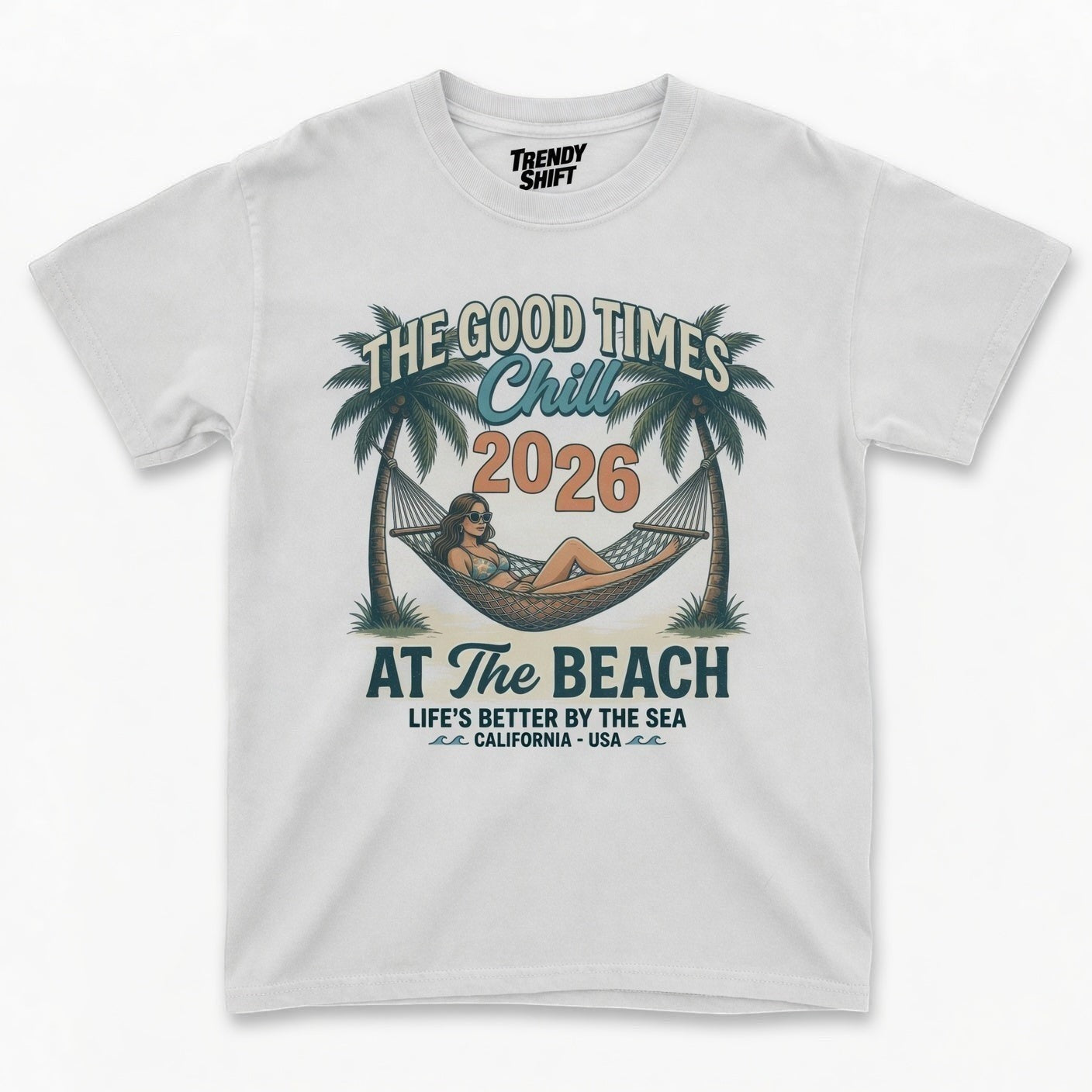 TrendyShift.Com white graphic t-shirt featuring a retro beach scene with a woman in a hammock and palm trees.